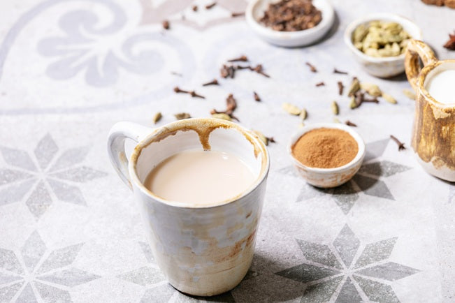 Masala chai served with Ceylon cinnamon sticks and green cardamom – cinnamon spiced chai recipe