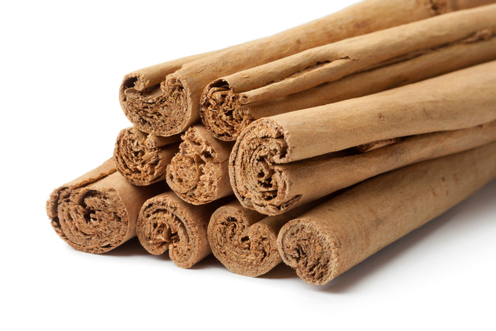 True Ceylon cinnamon sticks on white background – why real cinnamon costs more and is worth it