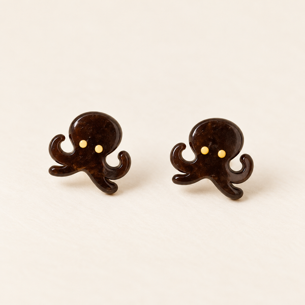 Brown Octopus Stud Earrings, pair on an ivory studio background