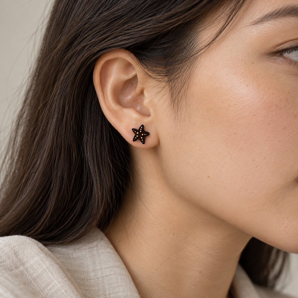 Brown Starfish Stud Earrings with Yellow Details, worn by an adult woman