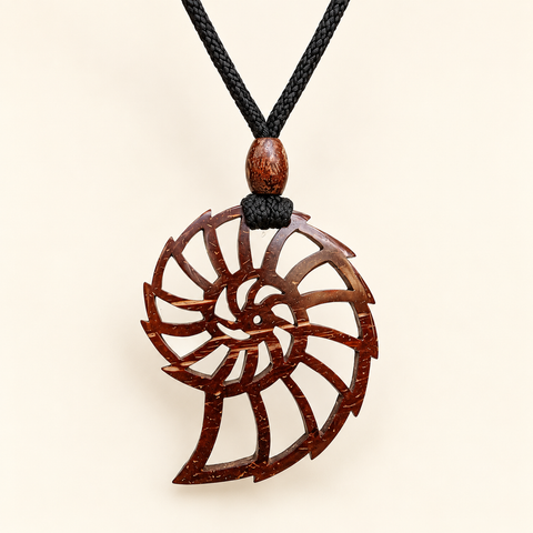 Fibonacci Spiral Coconut Shell Pendant Necklace, studio view showing pendant, bead and black cord on an ivory background