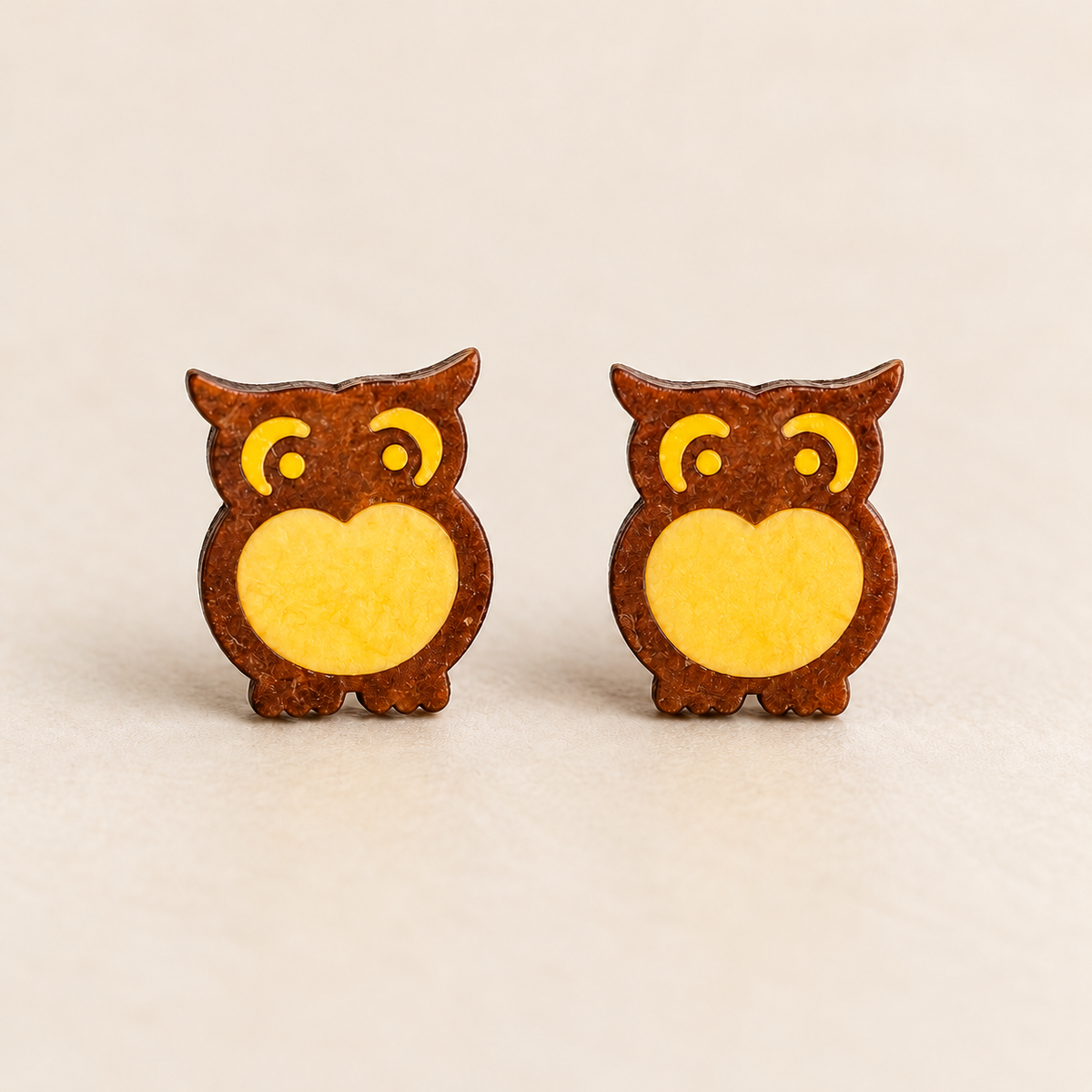 Midnight owl stud earrings with a flat face, studio pair