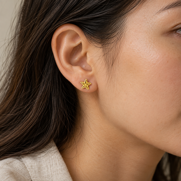 Yellow Starfish Stud Earrings, worn by an adult woman