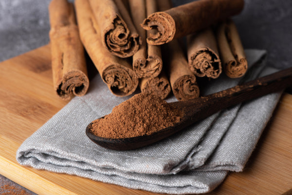 Ceylon cinnamon powder in wooden bowl – small batch, hand-selected spice
